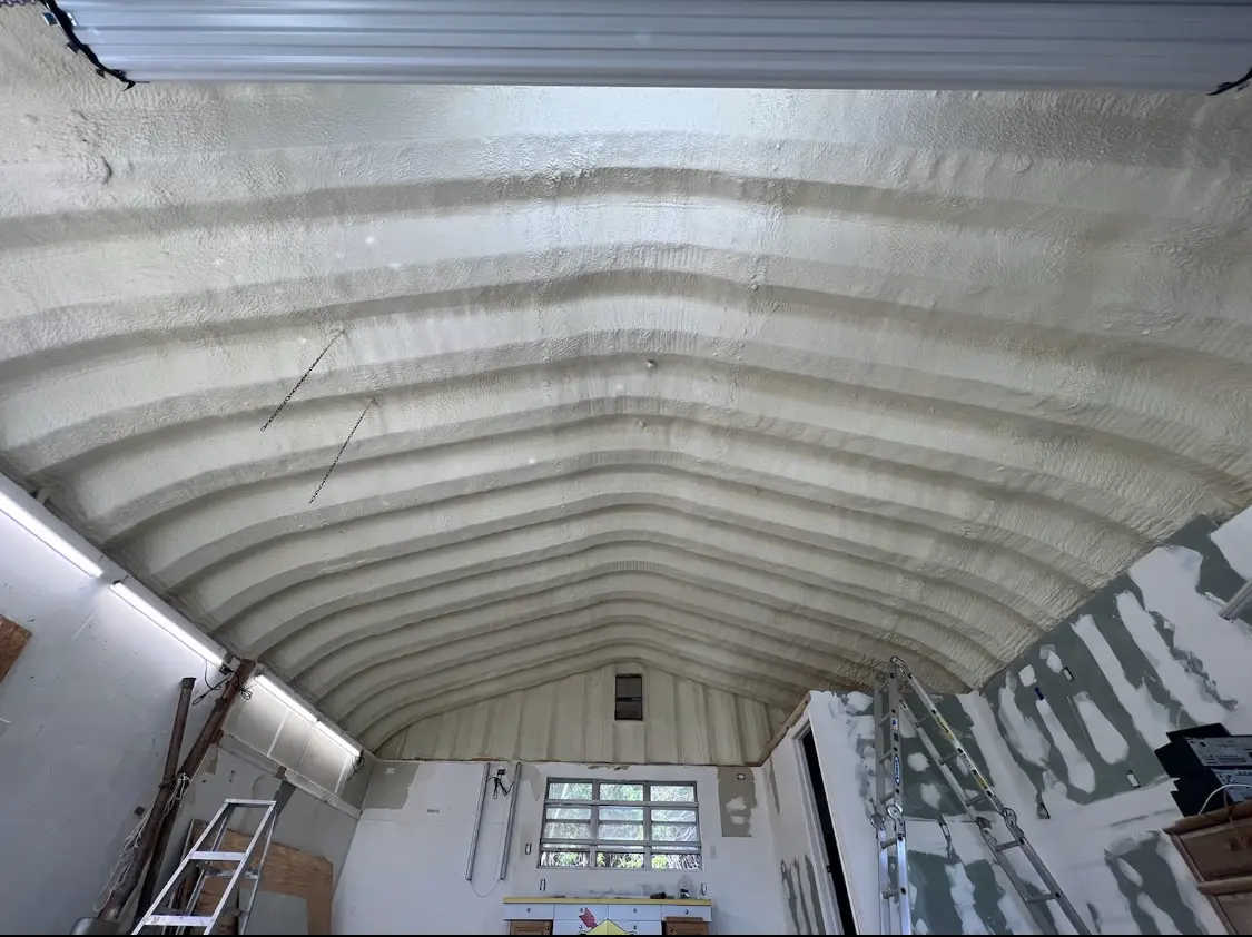 Spray polyurethane foam applied to the underside of a metal roof deck in Palm Coast